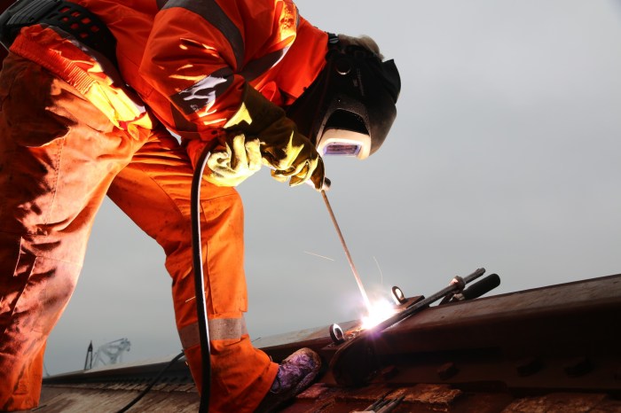 The rear side rail welds to the underside of the